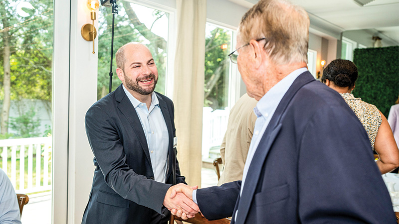 Two men shaking hands together
